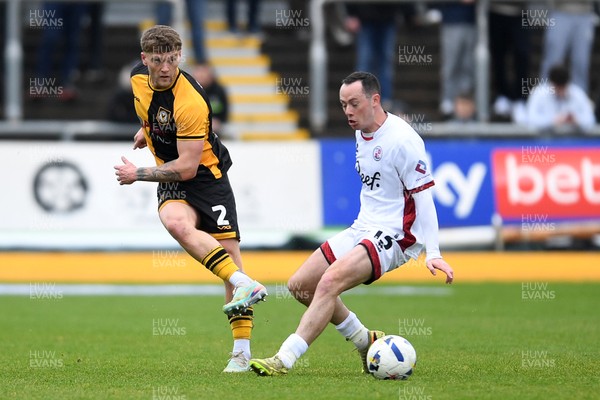 030426 - Newport County v Crawley Town - Sky Bet League 2 - Cameron Evans of Newport County is challenged by Harry McKirdy of Crawley