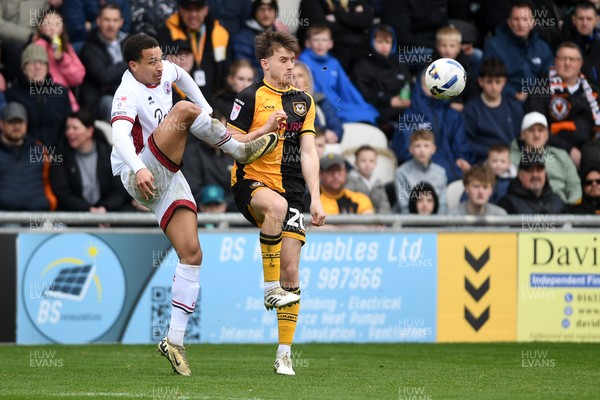 030426 - Newport County v Crawley Town - Sky Bet League 2 - Ben Lloyd of Newport County is challenged by Lewis Richards of Crawley