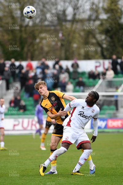 030426 - Newport County v Crawley Town - Sky Bet League 2 - Tom Davies of Newport County is challenged by Akinwale Odimayo of Crawley