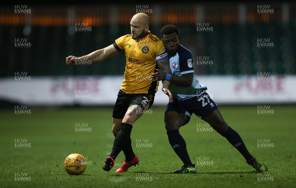 190118 - Newport County v Crawley Town, Sky Bet League 2 - David Pipe of Newport County holds off the challenge from Moussa Sanoh of Crawley Town