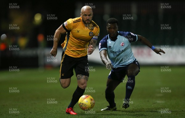 190118 - Newport County v Crawley Town, Sky Bet League 2 - David Pipe of Newport County holds off the challenge from Moussa Sanoh of Crawley Town