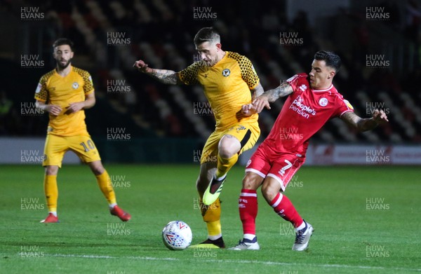 221019 - Newport County v Crawley Town, Sky Bet League 2 - Scot Bennett of Newport County holds off the challenge from Reece Grego-Cox of Crawley Town