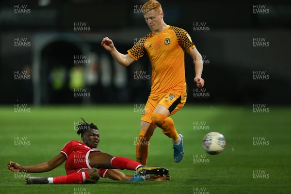 221019 - Newport County v Crawley Town, Sky Bet League 2 - Ryan Haynes of Newport County is tackled by David Sesay of Crawley Town