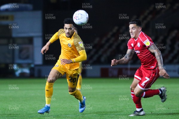 221019 - Newport County v Crawley Town, Sky Bet League 2 - Corey Whiteley of Newport County and Reece Grego-Cox of Crawley Town compete for the ball