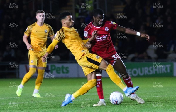 221019 - Newport County v Crawley Town, Sky Bet League 2 - Corey Whiteley of Newport County and Bez Lubala of Crawley Town compete for the ball