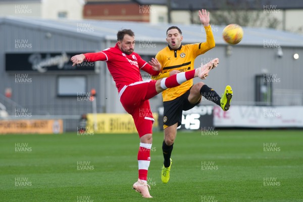 291218 - Newport County v Crawley Town - Sky Bet League 2 - Josh Payne of Crawley Town clears under pressure from  Robbie Willmott of Newport County 