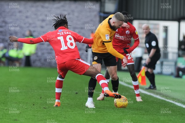 291218 - Newport County v Crawley Town - Sky Bet League 2 -  Dan Butler of Newport County is tackled by David Sesay of Crawley Town 