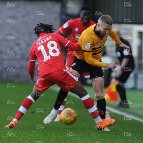 291218 - Newport County v Crawley Town - Sky Bet League 2 -  Dan Butler of Newport County is tackled by David Sesay of Crawley Town 