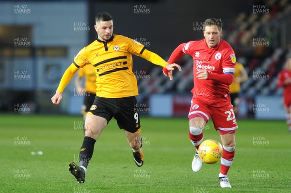 291218 - Newport County v Crawley Town - Sky Bet League 2 -  Padraig Amond of Newport County and Dannie Bulman of Crawley Town compete for the ball 