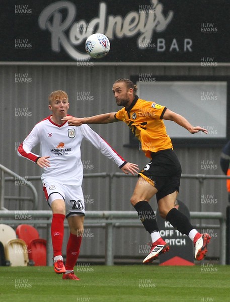 110818 - Newport County v Crewe Alexandra - Sky Bet League 2 - Fraser Franks of Newport County clears the danger from Charlie Kirk of Crewe Alexandra 