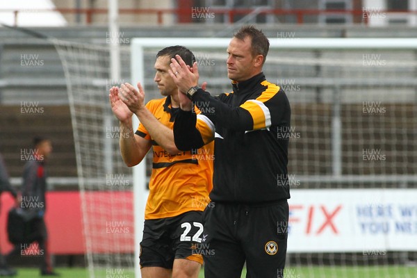 110818 - Newport County v Crewe Alexandra - Sky Bet League 2 - Manager of Newport County Michael Flynn (R) and captain Andrew Crofts applaud the fans after the final whistle