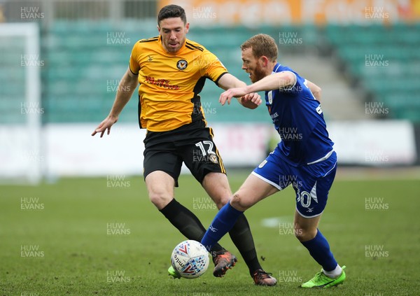 240318 - Newport County v Crewe Alexandra, Sky Bet League 2 - Ben Tozer of Newport County and Paul Green of Crewe Alexandra compete for the ball