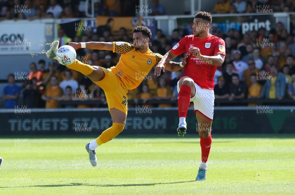 240819 - Newport County v Crewe Alexandra, Sky Bet League 2 - Corey Whiteley of Newport County lines up a spectacular shot at goal as Daniel Powell of Crewe Alexandra challenges