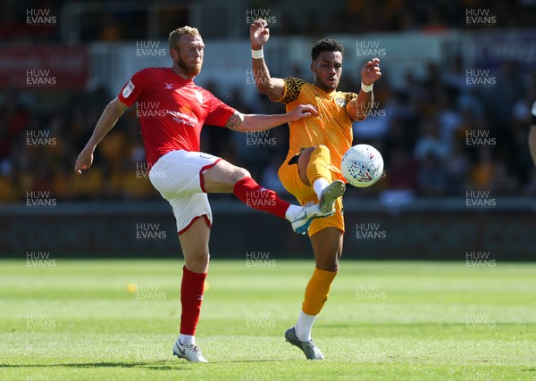 240819 - Newport County v Crewe Alexandra, Sky Bet League 2 - Corey Whiteley of Newport County and Paul Green of Crewe Alexandra compete for the ball