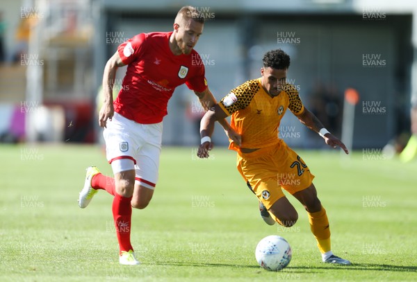240819 - Newport County v Crewe Alexandra, Sky Bet League 2 - Corey Whiteley of Newport County and Olly Lancashire of Crewe Alexandra compete for the ball