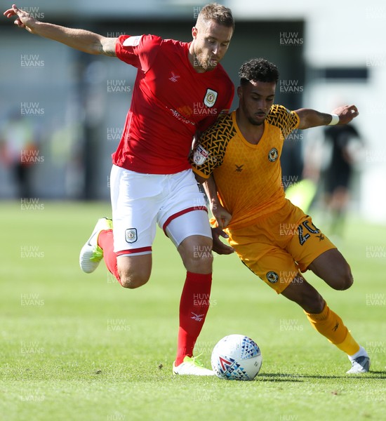 240819 - Newport County v Crewe Alexandra, Sky Bet League 2 - Corey Whiteley of Newport County and Olly Lancashire of Crewe Alexandra compete for the ball
