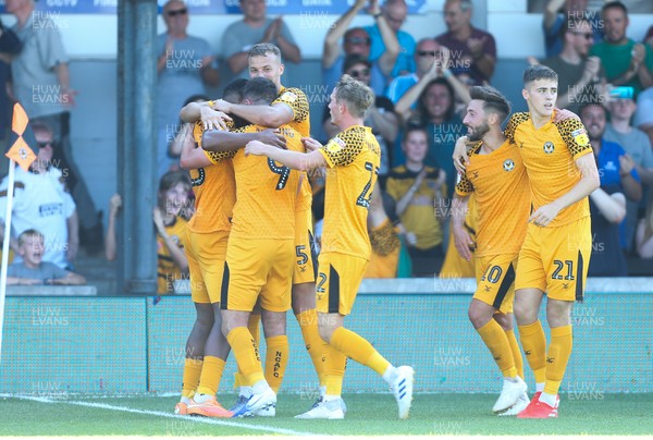 240819 - Newport County v Crewe Alexandra, Sky Bet League 2 - Newport County players celebrate with Padraig Amond after he score a late goal to win the match