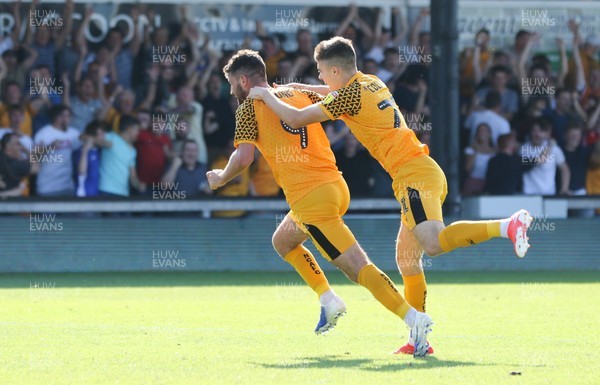 240819 - Newport County v Crewe Alexandra, Sky Bet League 2 - Padraig Amond of Newport County, left, wheels away to celebrate with Lewis Collins of Newport County after scoring the winning goal