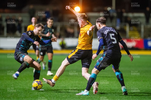 291223 - Newport County v Crewe Alexandra - Sky Bet League 2 - Will Evans of Newport County is tackled by Mickey Demetriou of Crewe Alexandra and Zac Williams of Crewe Alexandra