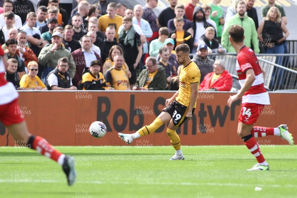120823 - Newport County v Doncaster Rovers - Sky Bet League 2 -  Shane McLoughlin of Newport County chips the ball forward