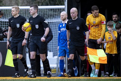 060124 - Newport County v Eastleigh - FA Cup Third Round - Referee Ed Duckworth leads the sides out ahead of kick off