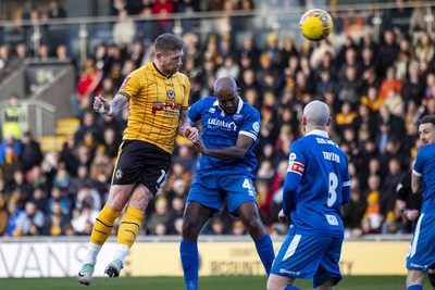 060124 - Newport County v Eastleigh - FA Cup Third Round - Scot Bennett of Newport County wins a header 