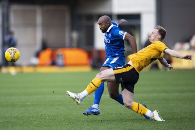 060124 - Newport County v Eastleigh - FA Cup Third Round - Harry Charsley of Newport County in action against Nigel Atangana of Eastleigh