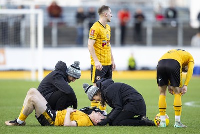 060124 - Newport County v Eastleigh - FA Cup Third Round - Will Evans of Newport County receives treatment 