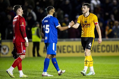 060124 - Newport County v Eastleigh - FA Cup Third Round - Ryan Delaney of Newport County with Luke Croll of Eastleigh at full time