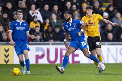 060124 - Newport County v Eastleigh - FA Cup Third Round - Seb Palmer-Houlden of Newport County in action against Luke Croll of Eastleigh