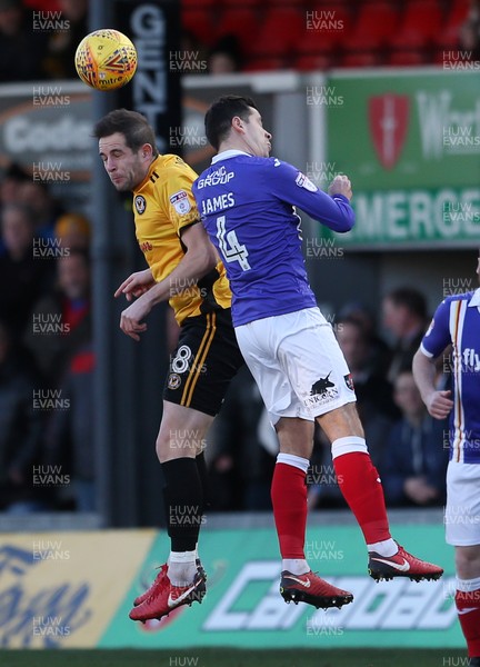 010118 - Newport Count v Exeter City - SkyBet League Two - Matthew Dolan of Newport County and Lloyd James of Exeter City go up for the ball