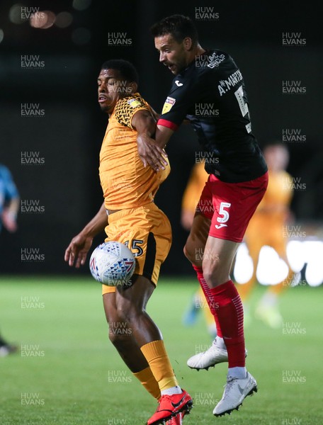 081019 - Newport County v Exeter City, EFL leasingcom Trophy - Tristan Abrahams of Newport County and Aaron Martin of Exeter City compete for the ball