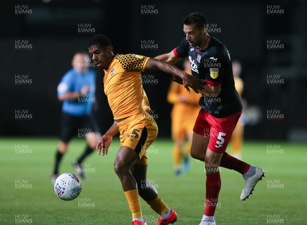 081019 - Newport County v Exeter City, EFL leasingcom Trophy - Tristan Abrahams of Newport County and Aaron Martin of Exeter City compete for the ball