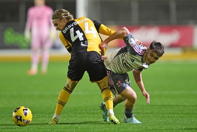 111125 - Newport County v Exeter City - Vertu Trophy - Sam Braybrooke of Newport County is challenged by Liam Oakes of Exeter