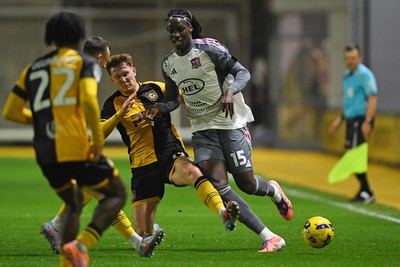111125 - Newport County v Exeter City - Vertu Trophy - Ged Garner of Newport County is challenged by Johnly Yfeko of Exeter