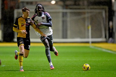 111125 - Newport County v Exeter City - Vertu Trophy - Ged Garner of Newport County is challenged by Johnly Yfeko of Exeter