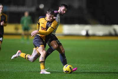 111125 - Newport County v Exeter City - Vertu Trophy - Kai Whitmore of Newport County is challenged by Reece Cole of Exeter