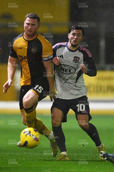 111125 - Newport County v Exeter City - Vertu Trophy - Lee Jenkins of Newport County is challenged by Jack Aitchison of Exeter