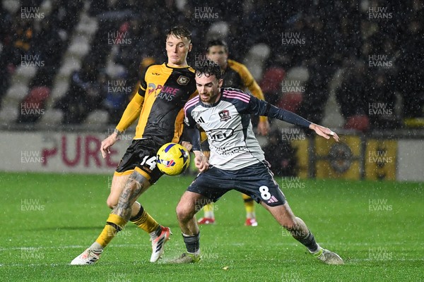 111125 - Newport County v Exeter City - Vertu Trophy - Kai Whitmore of Newport County is challenged by Ed Francis of Exeter