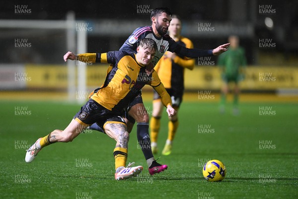 111125 - Newport County v Exeter City - Vertu Trophy - Kai Whitmore of Newport County is challenged by Reece Cole of Exeter