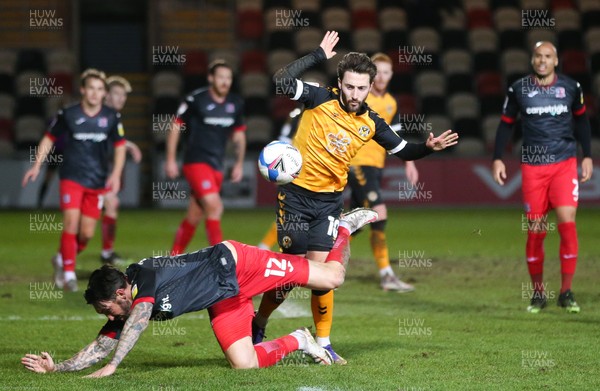 160221 - Newport County v Exeter City, Sky Bet League 2 - Josh Sheehan of Newport County and Ryan Bowman of Exeter City compete for the ball