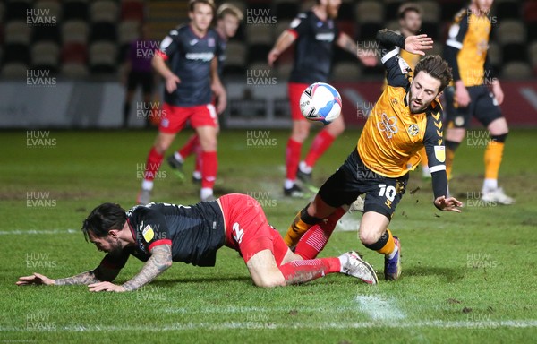 160221 - Newport County v Exeter City, Sky Bet League 2 - Josh Sheehan of Newport County and Ryan Bowman of Exeter City compete for the ball