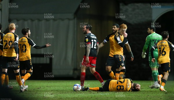 160221 - Newport County v Exeter City, Sky Bet League 2 - Mickey Demetriou of Newport County is left on the floor after a challenge from Ryan Bowman of Exeter City which earned Bowman a red card It was Exeter's second red card of the match