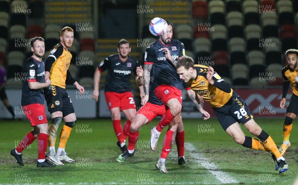 160221 - Newport County v Exeter City, Sky Bet League 2 - Mickey Demetriou of Newport County tries to head a shot at goal