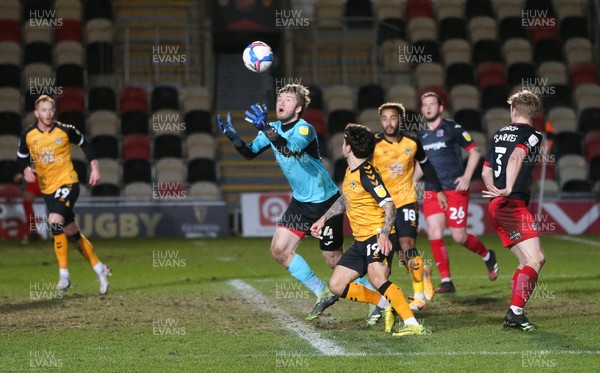 160221 - Newport County v Exeter City, Sky Bet League 2 - Exeter City goalkeeper Jokull Andresson takes the ball as Dom Telford of Newport County closes in