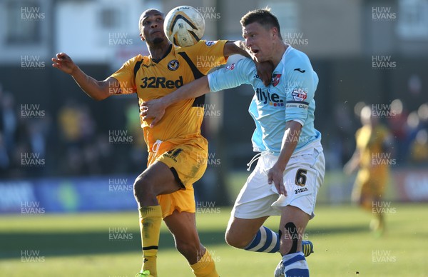 160314 - Newport County v Exeter City, Sky Bet League 2 - Newport's Chris Zebroski and Exeter's Danny Coles compete for the ball