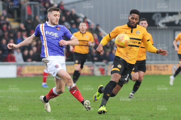 190119 - Newport County v Exeter City - Sky Bet League 2 -  Dara O'Shea of Exeter City clears under pressure from Tyreeq Bakinson of Newport County