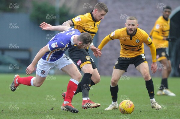 190119 - Newport County v Exeter City - Sky Bet League 2 - Scot Bennett of Newport County tackles Jake Taylor of Exeter City 
