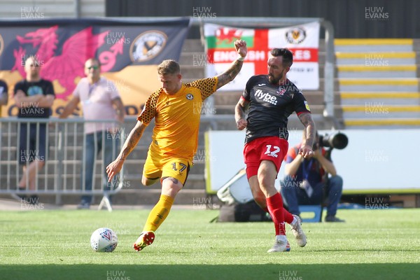 210919 Newport County vs Exeter City - Sky Bet League 2 - Scot Bennett of Newport County clears under pressure from Ryan Bowman of Exeter City 