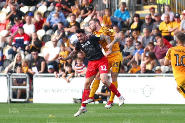 210919 Newport County vs Exeter City - Sky Bet League 2 - Mark O Brien of Newport County and Ryan Bowman of Exeter City compete for a high ball 